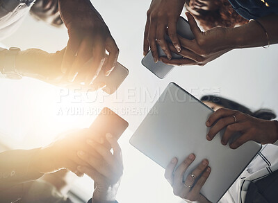 Buy stock photo Technology, business and hands of people in circle for data sharing, meeting or collaboration with connectivity. Phone, tablet and team at digital agency with networking, research or app low angle