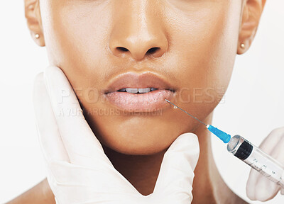 Buy stock photo Woman, lips and surgical needle in studio for botox, plastic surgery or facial treatment on a white background. Closeup of female person with hands for medical implant or mouth filler enhancement