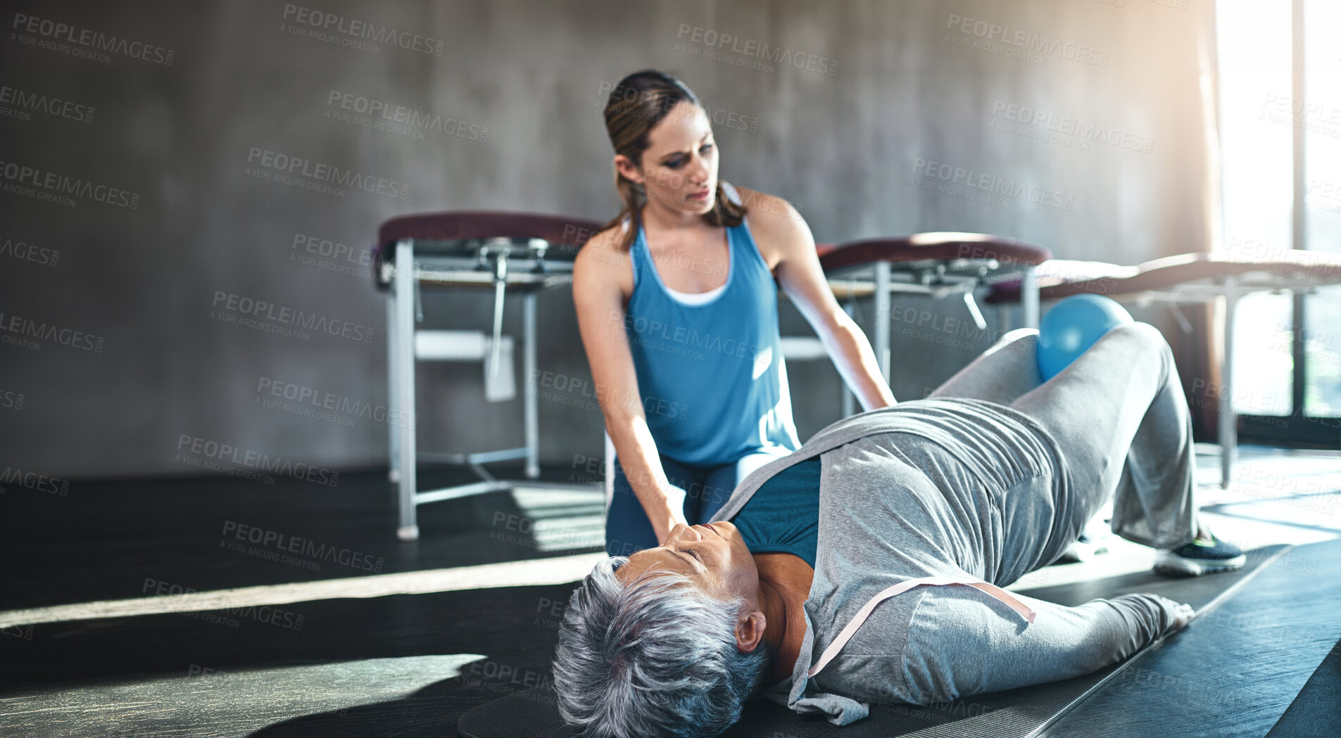 Buy stock photo Physiotherapist, senior woman and stretching with exercise, wellness and recovery with injury. People, physical therapy and mature client in gym, fitness or healthy person with workout routine