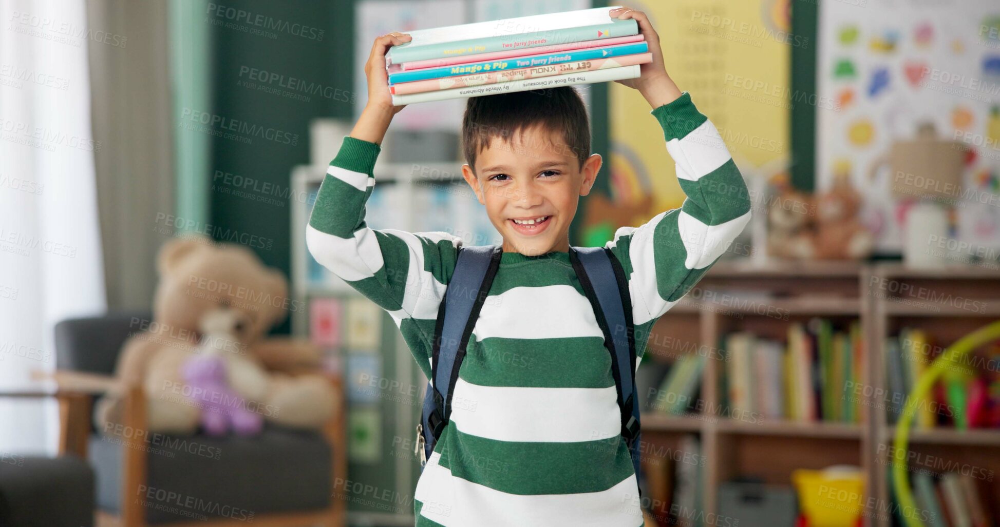 Buy stock photo Child, face and book on head with laugh in classroom for learning education for back to school, library or alphabet. Boy, kid and happy laughing for future academic with funny joke, student or story