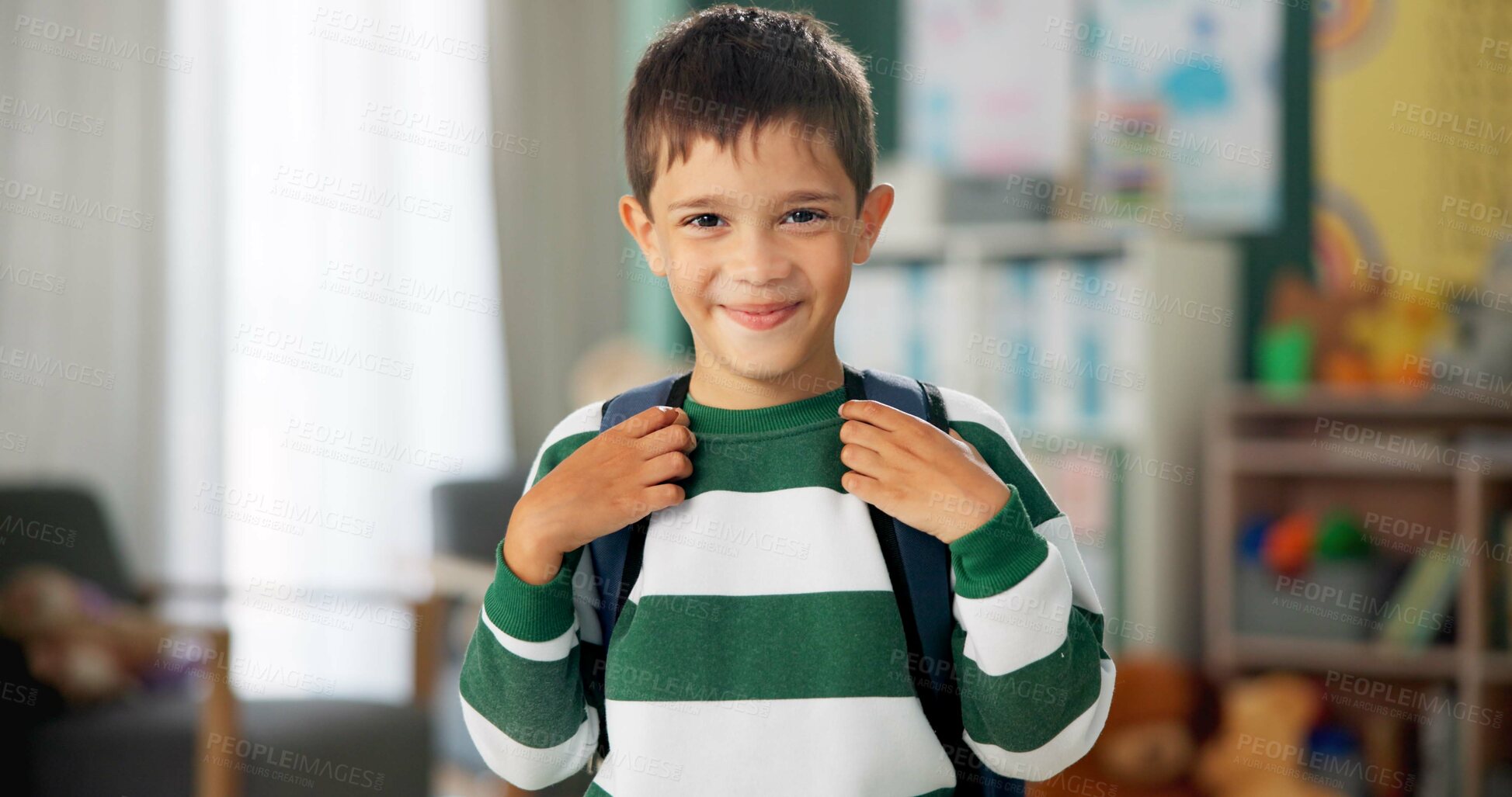 Buy stock photo Child, face and laughing in school classroom or education with backpack for kindergarten, learning or joke. Boy, kid and portrait for study development on academy campus or student, humor or funny