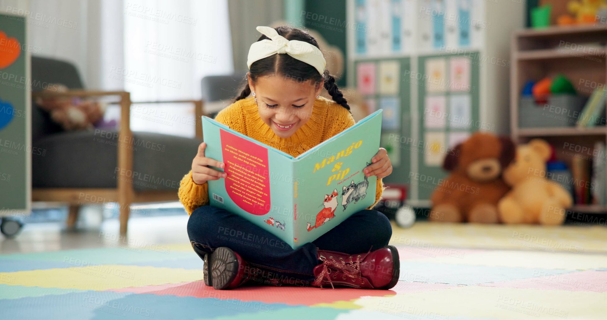 Buy stock photo Girl, school and reading book in classroom, childhood development and growth for vocabulary in kindergarten. Happy, smile and knowledge or information with storybook, learning and fantasy for child