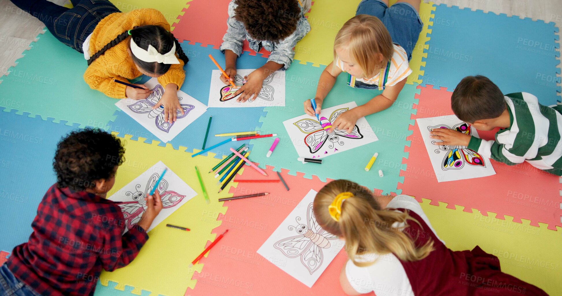 Buy stock photo Children, group and drawing for creative learning in classroom for education, project or back to school. Boys, girls and friends on floor mat for student art lesson or Montessori, youth or playing