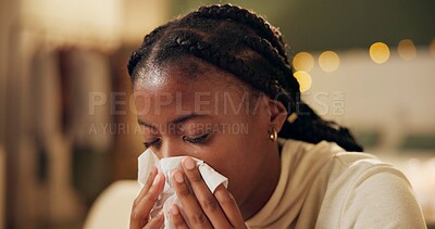 Buy stock photo Woman, sick and tissue for sneezing in home with blowing nose, recovery and night virus in living room. African person, infection or ill with fever, sinus and allergy with healthcare and suffering