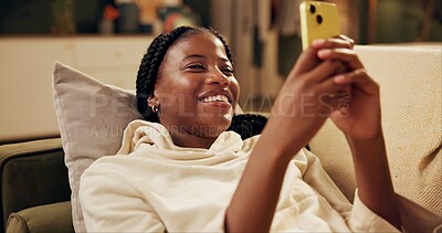 Buy stock photo Black woman, couch and laughing with smartphone for social media, online comic and funny chat with friends. Gen z girl, mobile and smile for internet joke with happy, meme and streaming video on sofa