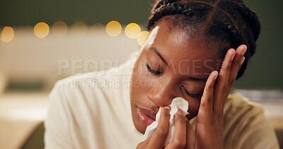 Buy stock photo Woman, sick and tissue for sneezing in home with blowing nose, recovery and night virus in living room. African person, infection or ill with fever, sinus and allergy with healthcare and suffering