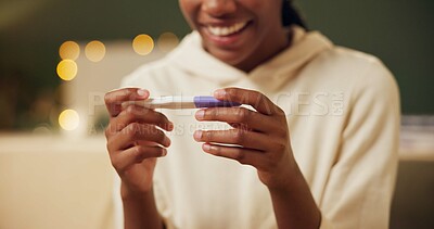 Woman, pregnancy test and excited or surprised in home with good news, fertility and ivf success journey. Hands, new mother and happy with results of testing kit on sofa for future motherhood and wow