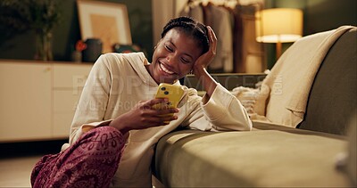 Happy, laugh and black woman with phone on sofa for online chat, communication and networking. Relax, home and person on smartphone for social media, funny website and internet news in living room