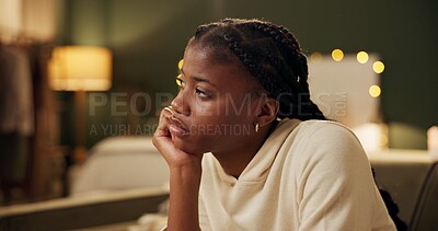 Buy stock photo Sad, thinking and black woman in home with depression after breakup, trauma or frustrated by stress. College, student and girl with crisis in mental health, anxiety or remember problem with fatigue