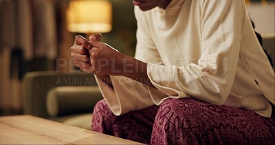 Black girl, hands and worry with stress on sofa for student loans or academic pressure, anxiety and depression. Woman, home and burnout on couch for fear of bad news or mistake, nervous and scared.