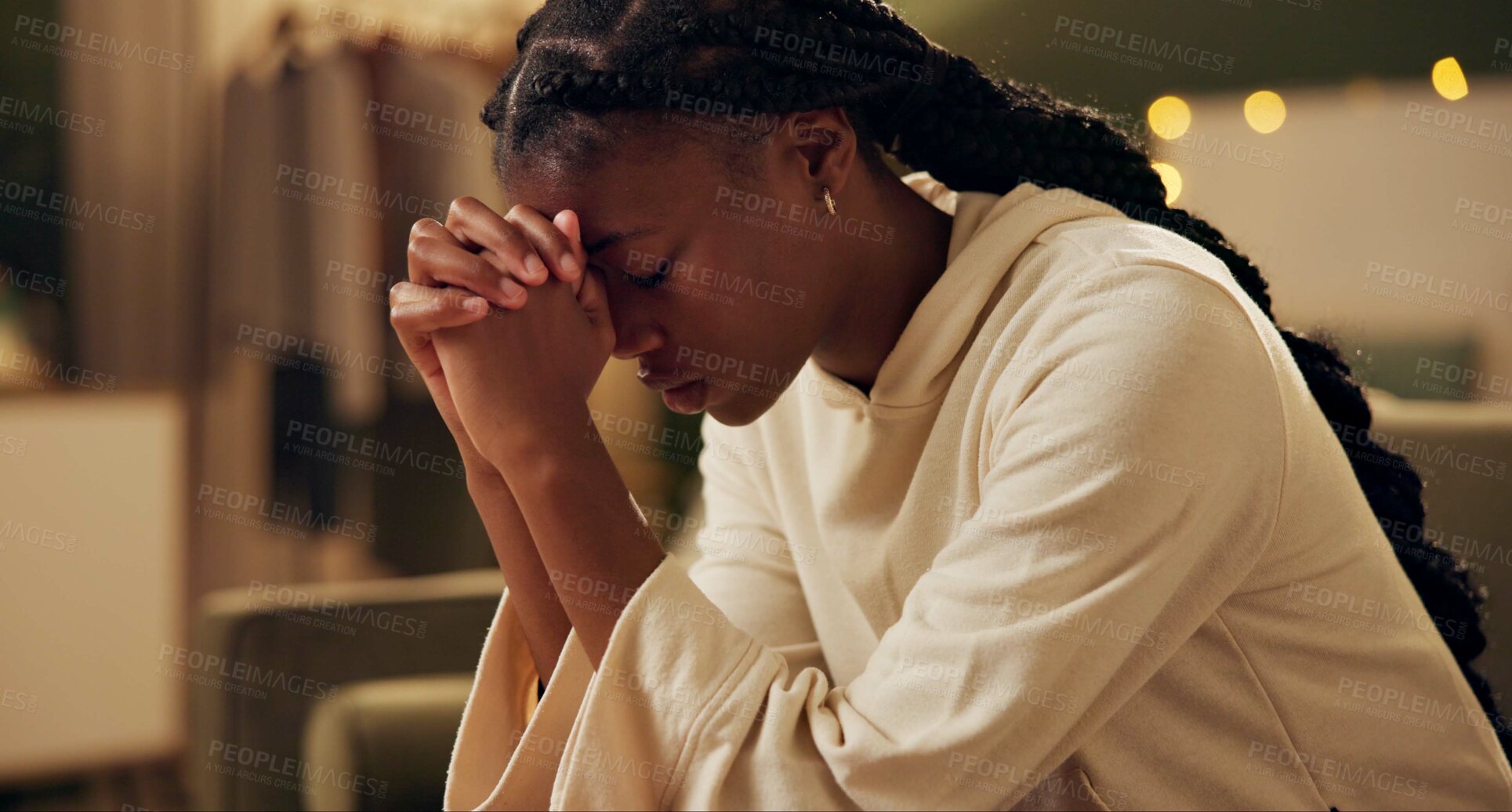 Buy stock photo Black girl, worship or pray on sofa in home for solace or devotion, spiritual connection and wellness gratitude to god. Woman, eyes closed and prayer to higher power for praise or hope and christian.