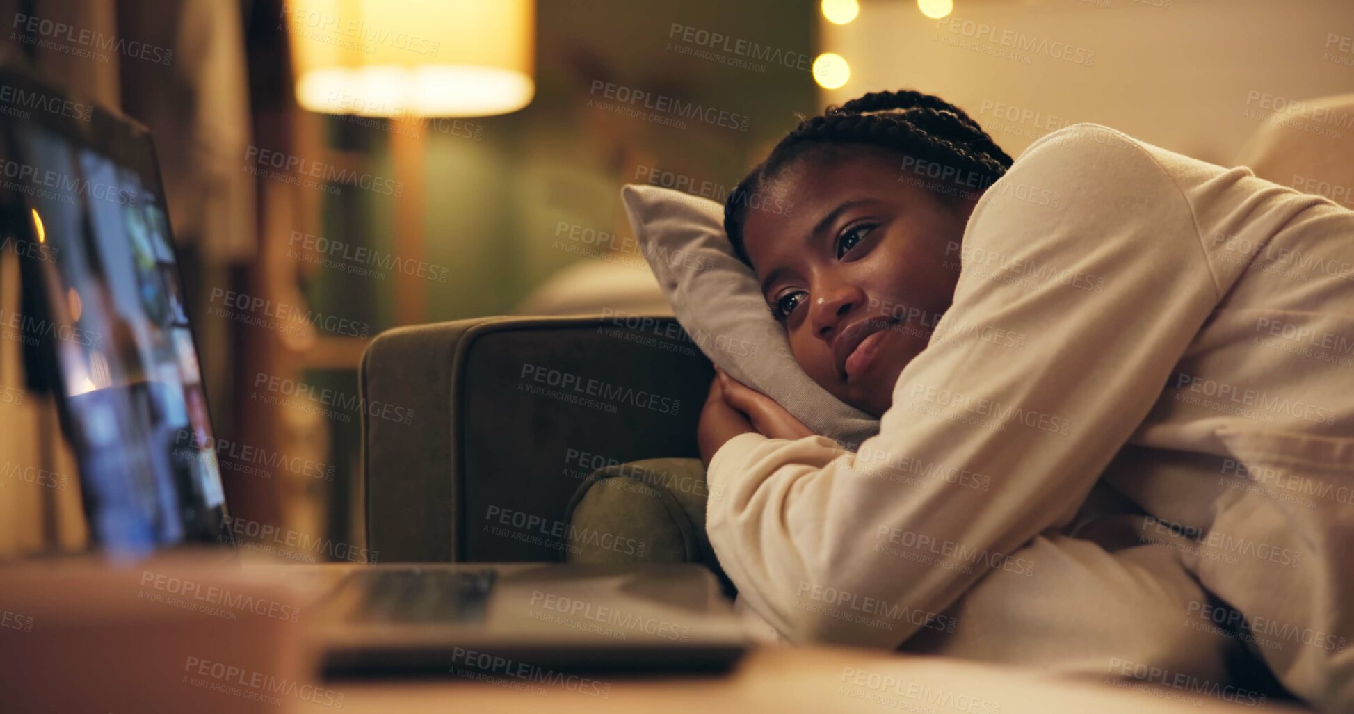 Buy stock photo African woman, laptop and movie on sofa to relax in night for vacation, break and online subscription in home. Girl, person and computer for film, series and screen with smile on couch in living room