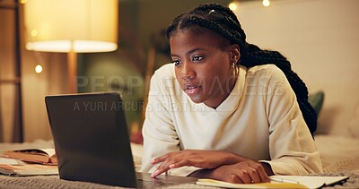 Buy stock photo Education, laptop and night with black woman on bed in home for distance learning or remote study. Computer, evening research and notebook with college or university person in bedroom of apartment