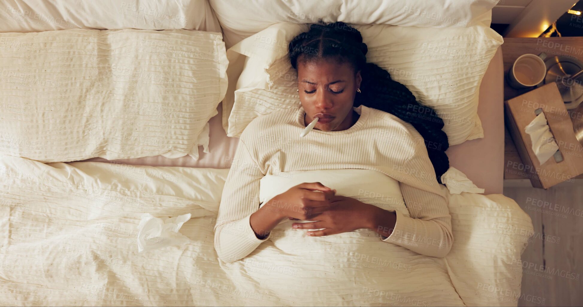 Buy stock photo Woman, thermometer and mouth with sick in bed with tissue, flu and temperature check for fever in home. African person, medical tool and top view with blanket in bedroom for illness, health and virus