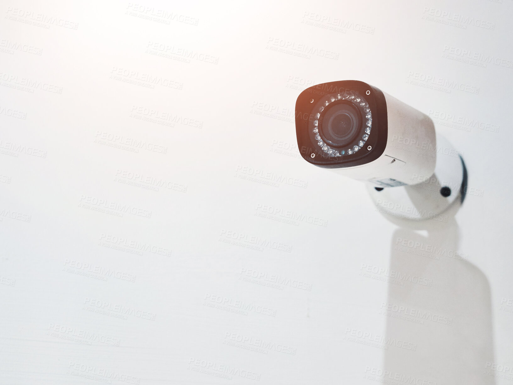 Buy stock photo Camera, surveillance and safety security on wall, protection and crime monitoring for criminal activity. Broadcasting, video and live feed for control room, movement detection and vigilance in office