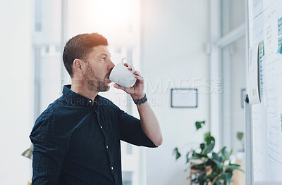 Buy stock photo Man, drink and coffee in office for brainstorming with whiteboard, thinking and planning for day ahead or creative tasks. Project manager, ideas and thoughts for campaign schedule and goal setting.