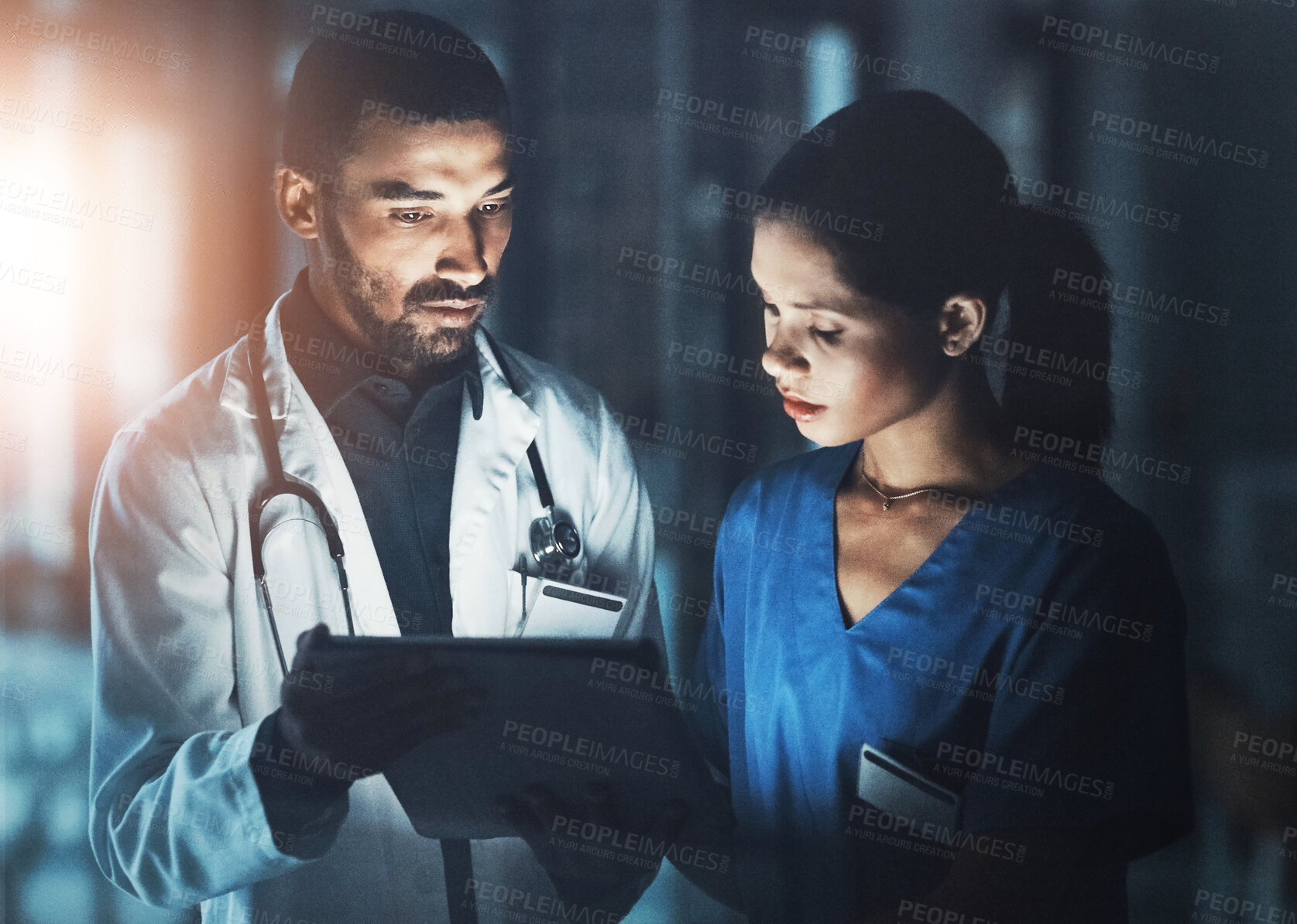 Buy stock photo Doctor, nurse and discussion with tablet at night for patient updates and emergency response. Dark, people and online for medication administration, clinical documentation and treatment planning.