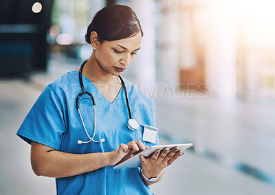 Buy stock photo Healthcare, tablet and woman nurse in hospital for diagnosis, reading medical records or research. Medicine, technology and wellness with serious health professional in clinic for info or insurance