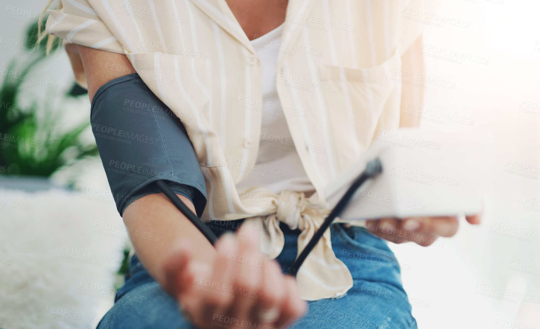 Buy stock photo Arm, home and woman with blood pressure monitor for heart rate, bpm and cardiovascular health. Hypertension, medical and female person with equipment for measuring  arteries for checkup at home.