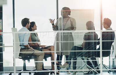 Buy stock photo Business people, presentation and woman in meeting, planning and brainstorming for project. Group, employees and presenter with confidence, diversity and leadership with review, workshop and feedback