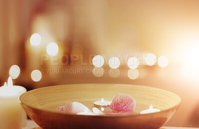 Buy stock photo Candles, atmosphere and flowers in bowl at spa for calm, zen and peace aromatherapy for relaxation. Flame, retreat and floral plants for luxury, serenity natural treatment at beauty salon with bokeh.