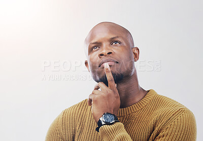 Buy stock photo Black man, thinking and question with choice, decision or pondering in studio on a white background. Young African, male person or model in wonder, thought or contemplating for option, choose or pick