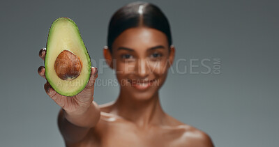 Beauty, skincare and happy woman in studio with avocado, natural cosmetics isolated on grey background. Makeup, healthy organic dermatology and skin care model with spa or salon fruit detox facial.