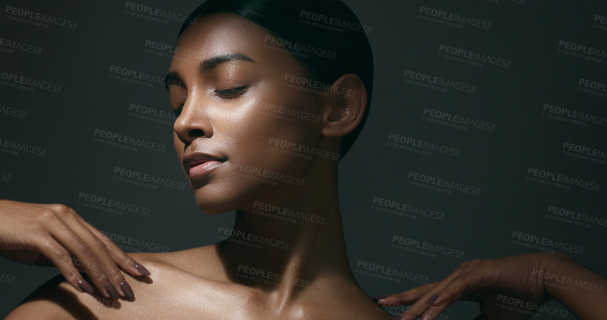 Buy stock photo Beauty, sensual and face of woman in studio for cosmetic, natural and dermatology treatment. Skincare, clean and young Indian female model with healthy glow skin moving isolated by gray background.