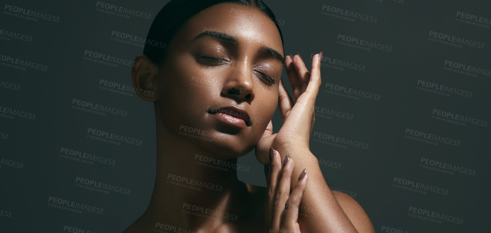 Buy stock photo Beauty, sensual and face of woman in a studio with body care, wellness and health routine. Cosmetic, movement and portrait of an Indian female model with glowing skin treatment by a black background.