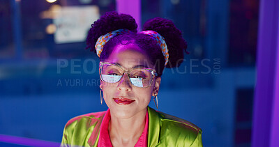 Computer, face and neon with programmer woman in office at night for coding or developing. Smile, typing and glasses with happy young game developer in workplace for system or interface upgrade