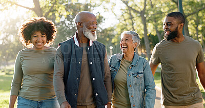 Buy stock photo Walking, outdoor and family in park, sunshine and happiness with weekend break, hobby and activity. Group, parents and kids with mother, father and conversation with smile, bonding together and joy