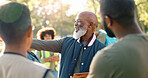 Park, black man and volunteers discussion with tablet for support, community project or nature sustainability. Humanitarian, recycling or senior leader in charity service or NGO for pollution cleanup