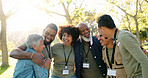 Huddle, happy and group of volunteer outdoor with collaboration, teamwork and solidarity for charity work. Hug, smile and people or ngo in park with cooperation, community and together for donation