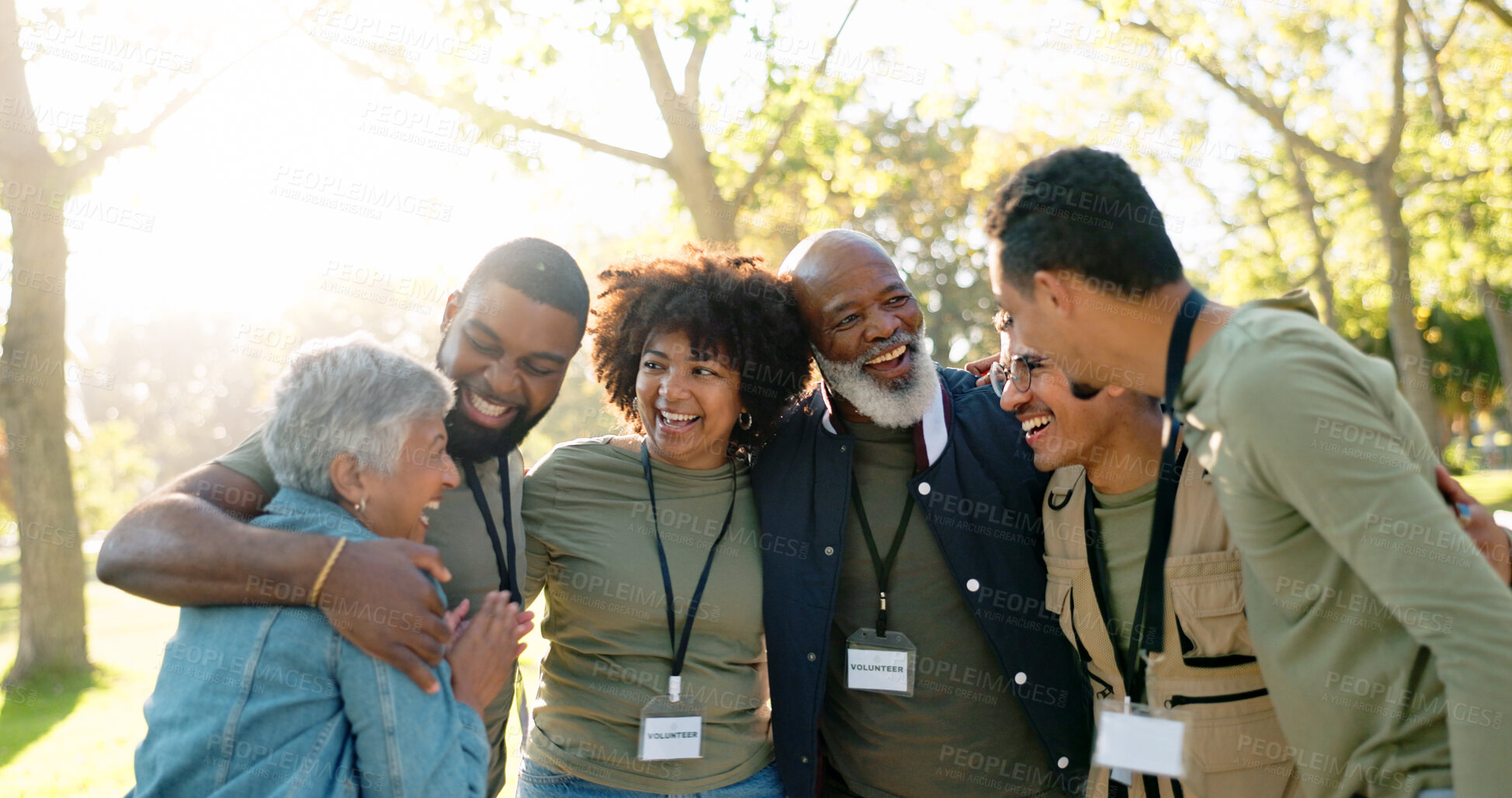 Buy stock photo Huddle, happy and group of volunteer outdoor with collaboration, teamwork and solidarity for charity work. Hug, smile and people or ngo in park with cooperation, community and together for support