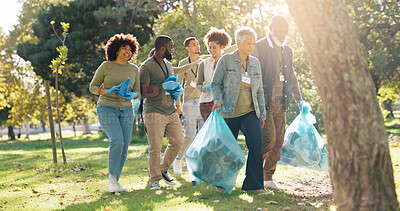 Buy stock photo People, volunteer and smile for pick up dirt at park with plastic bag for cleaning, earth day and community service. Outdoor, litter and waste collection for maintenance, environment and charity work