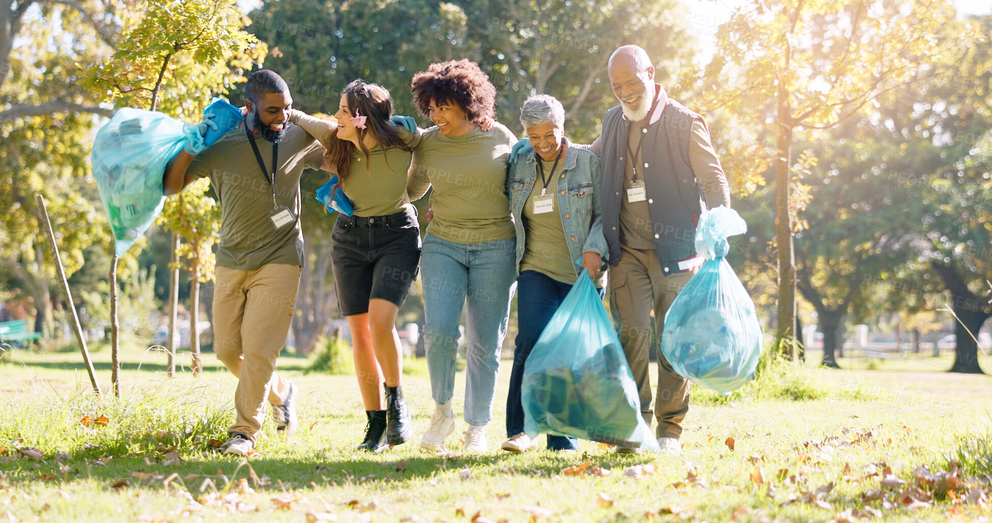 Buy stock photo People, volunteer and happy with dirt clean at park with plastic bag for pick up, earth day and community service. Smile, waste collection and maintenance for environment, health and charity