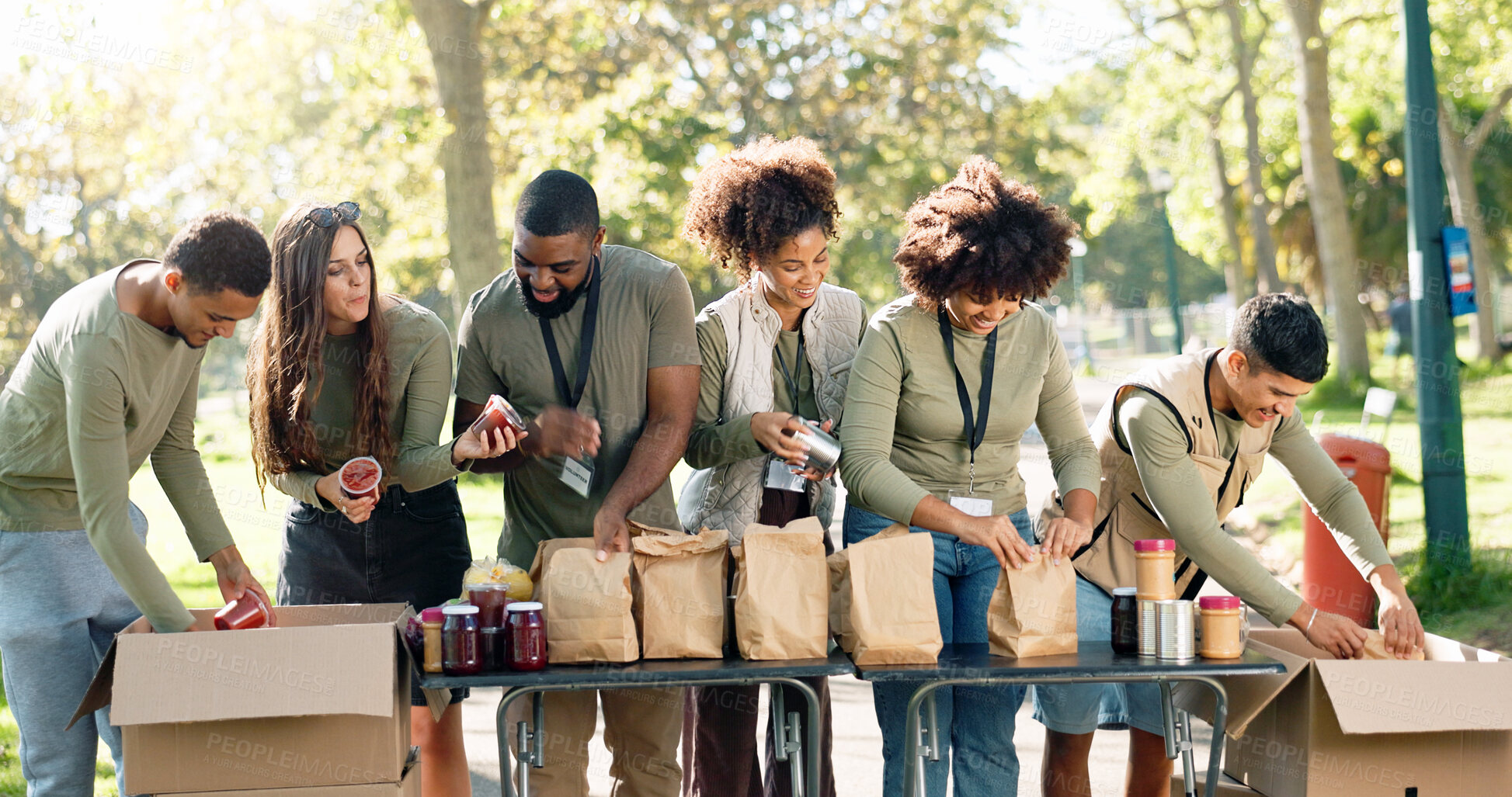 Buy stock photo People, volunteering and help package or outdoor, kindness ngo and charity project with community in park. Distribution, food parcel and grocery boxes for donation, teamwork and collaboration