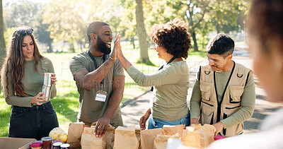 Buy stock photo Charity, high five and volunteer team in park with parcel for donation, distribution or community service. NGO, diversity and happy people with parcel for teamwork, kindness or social responsibility