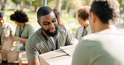 Buy stock photo Charity, cardboard boxes and volunteer in park for donation, distribution or community service. Help, NGO and people with package for support, kindness or social responsibility with teamwork