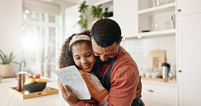 Buy stock photo Kitchen, dad and girl with card, bonding and gift of fathers day, love and family in house. Home, man and daughter with embrace, happiness and cute in apartment, parent or child with hug for present