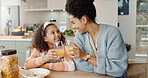 Kitchen, mother and girl with smile, juice and cheers for breakfast, bonding and love in house. Home, mom and daughter in apartment, happy and care for family, woman and child with joy and relax