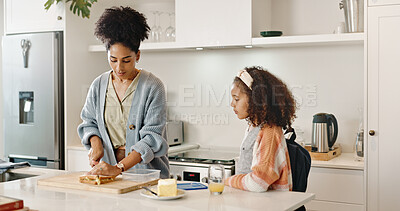 Mother, child and school lunch or sandwich in home cooking or preparing food in morning, nutrition or meal. Woman, daughter and student development with youth snack for wellness, health or kitchen