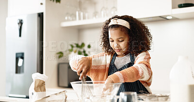 Girl, baking and mixing in home kitchen or batter, house and motor skills or childhood development for culinary education. Cooking, cookie dough and happy dessert, bowl and ingredients with utensils