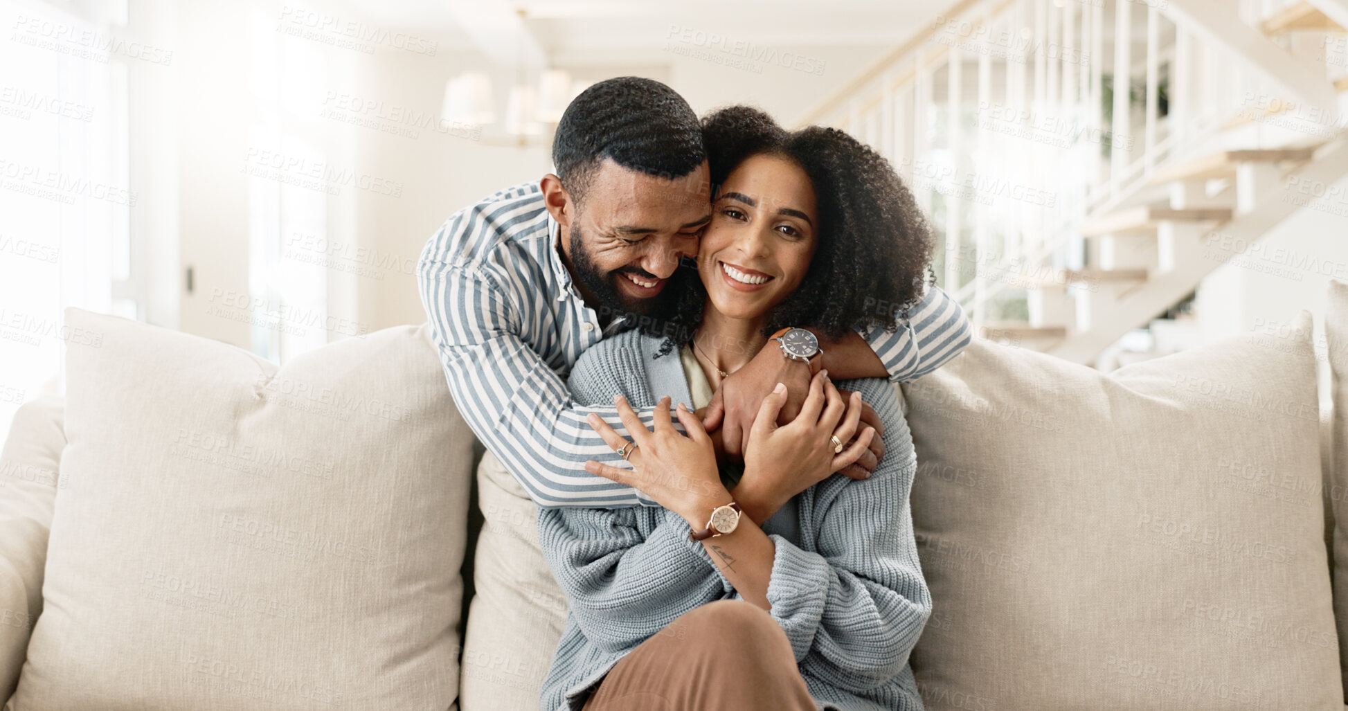 Buy stock photo Couple, portrait and hug or relax on sofa for date night or weekend break, romance and happiness with love or commitment. Man, woman and bonding on couch in new apartment or home, affection and care.