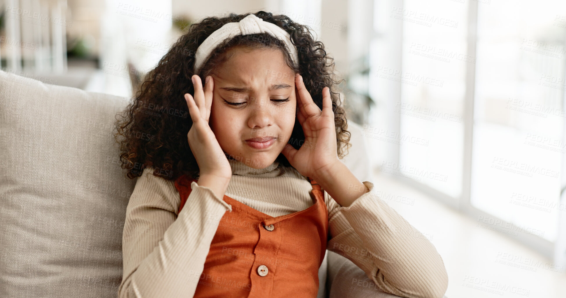 Buy stock photo Little girl, headache and sofa with stress in anxiety, depression or loneliness at home. Young female person, child or kid with migraine or alone on living room or lounge couch in fatigue or burnout