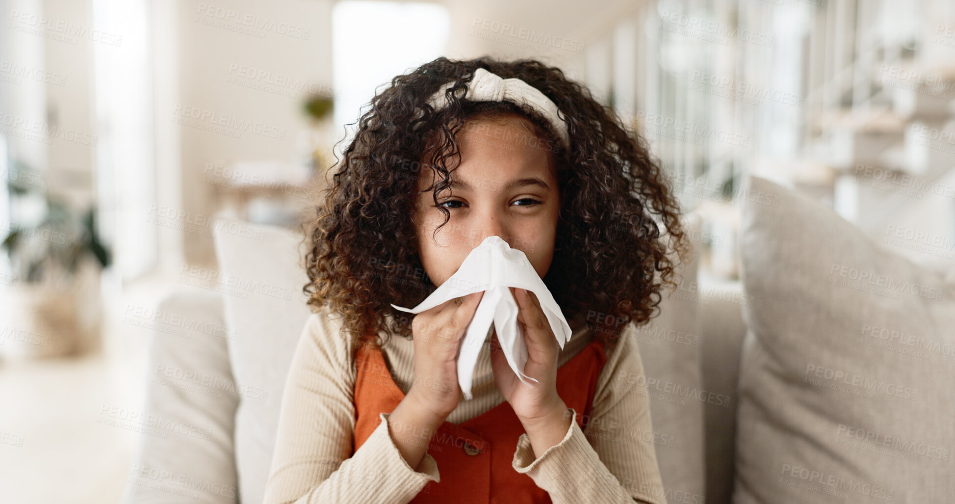 Buy stock photo Sick girl, sofa and blowing nose with tissue for virus, infection or congestion in living room at home. Young female person, child or kid with cold, flu or sinus in fatigue, fever or sneeze at house