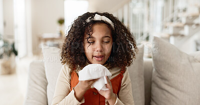 Buy stock photo Little girl, sofa and blowing nose with tissue for virus, infection or sneeze in living room at home. Young female person, child or sick kid with congestion, sinus or mucus for cold, flu or fever