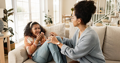 Buy stock photo Mom, sad and comfort girl on sofa with kindness, empathy and listening to trauma in living room at house. Crying, African mother and daughter with support, love and console in lounge at family home