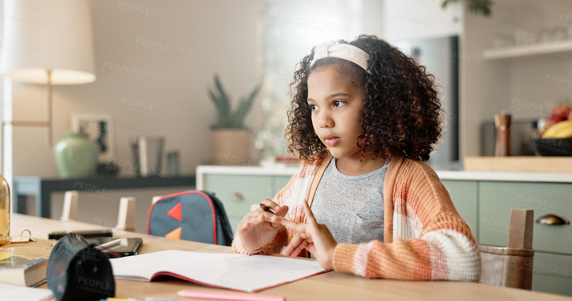 Buy stock photo Little girl, thinking and counting with book in kitchen for mathematics, homework or assessment at home. Young female person, child or kid in wonder or thought with addition or numbers at house