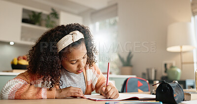 Buy stock photo Little girl, student and writing with book in kitchen for homework or assessment at home. Young female person, child or kid taking notes or studying with stationery for learning or education at house